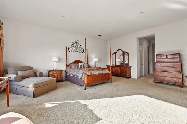 a bathroom with a tub sink shower and mirror