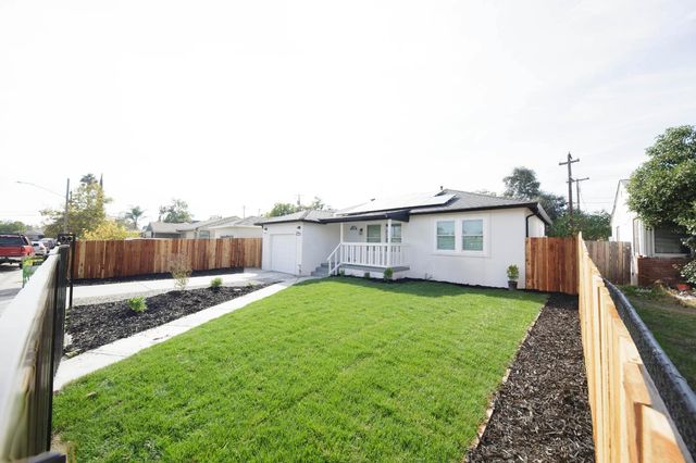 a view of a backyard with a garden