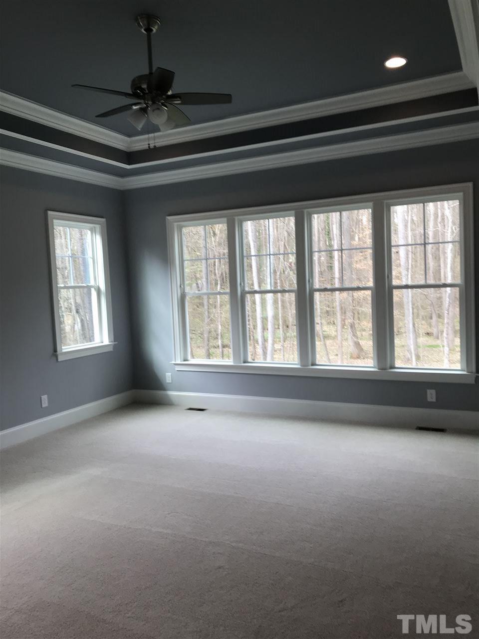 8707 Duckview Court Raleigh, NC 27613 - Photo 11 of 25 a view of an empty room with a window