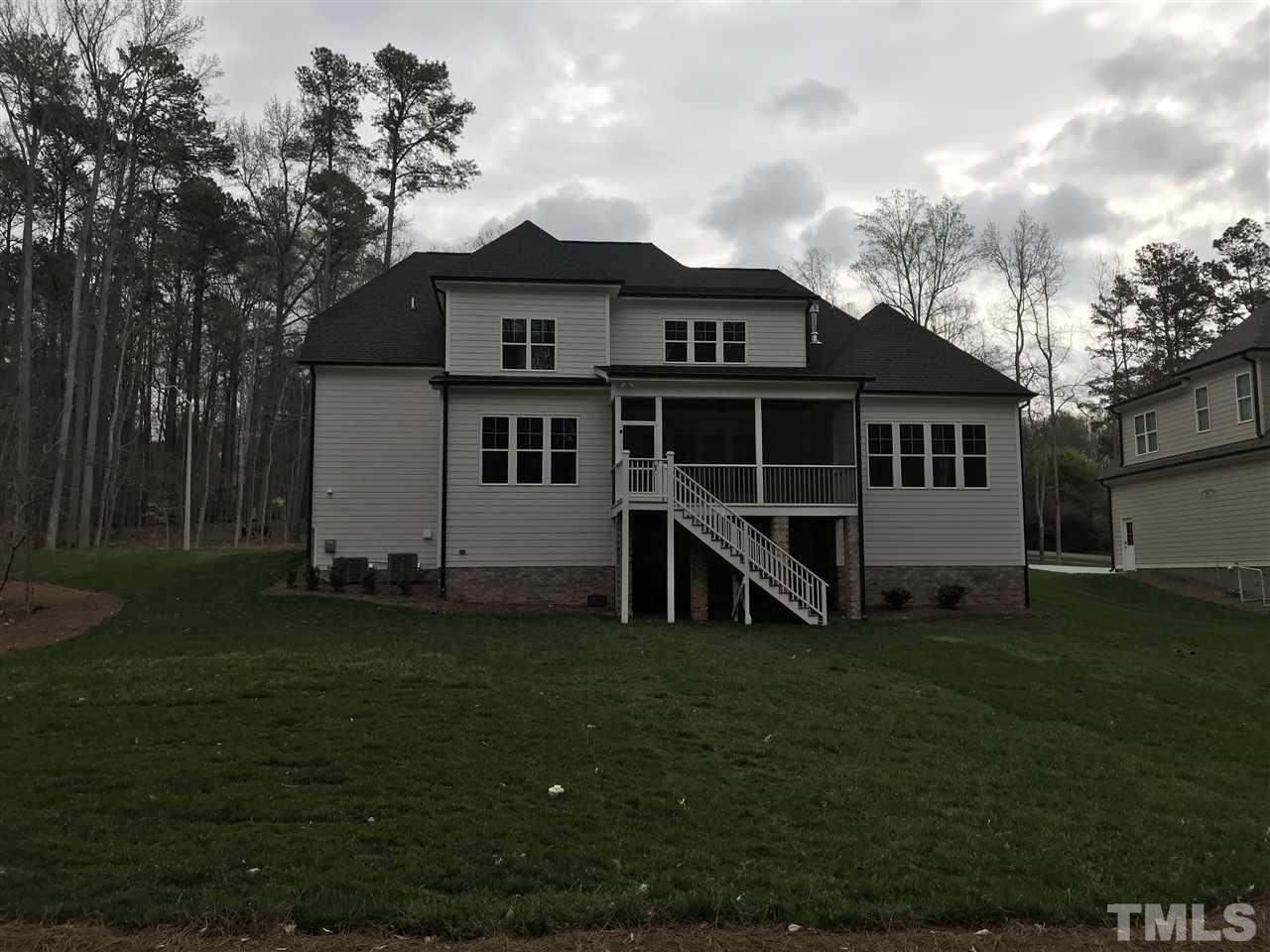 8707 Duckview Court Raleigh, NC 27613 - Photo 21 of 25 a view of a house with a yard