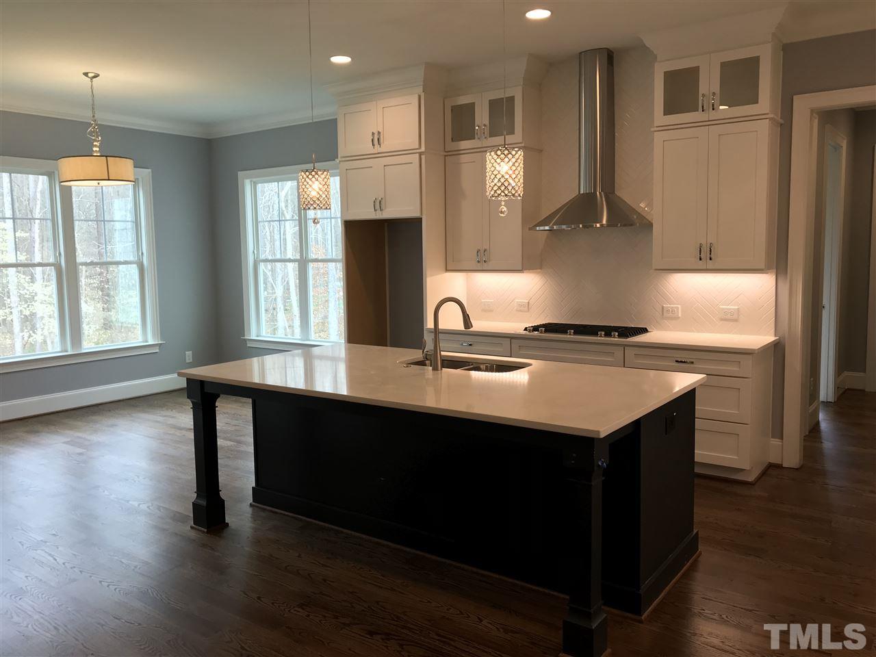 8707 Duckview Court Raleigh, NC 27613 - Photo 5 of 25 a kitchen with counter top space and window