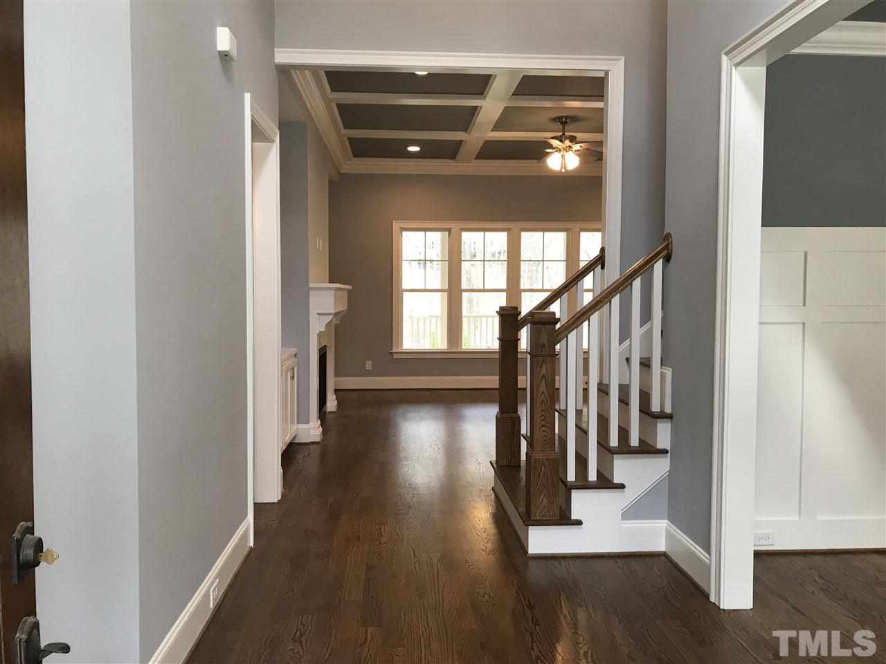 8707 Duckview Court Raleigh, NC 27613 - Photo 8 of 25 a view of entryway and hall with wooden floor