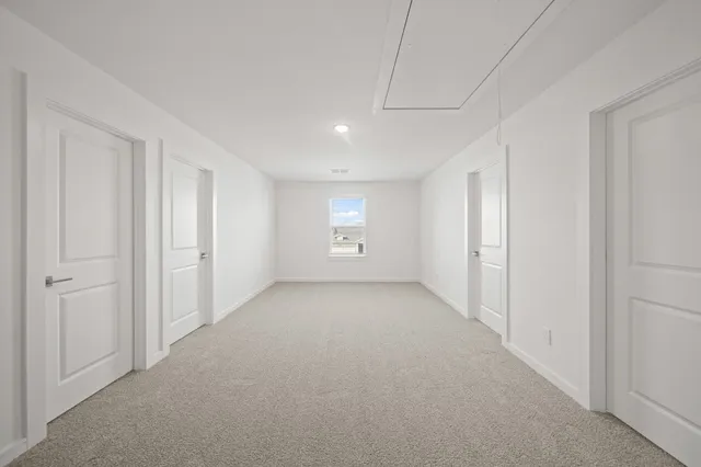 a view of an empty room and window
