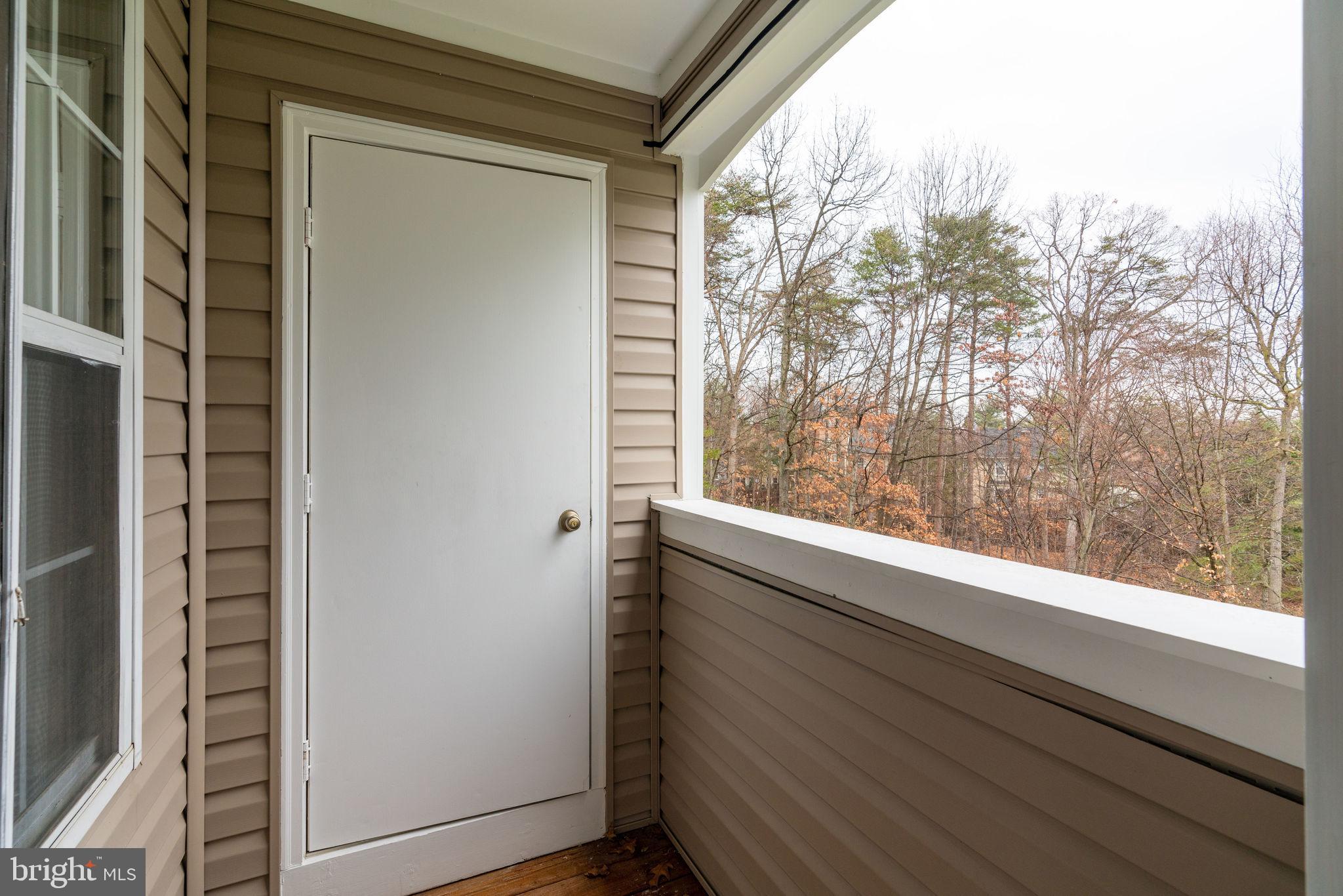7800 D Harrowgate Circle, Unit 130 Springfield, VA 22152 - Photo 36 of 48 Great deck overlooks trees and foliage