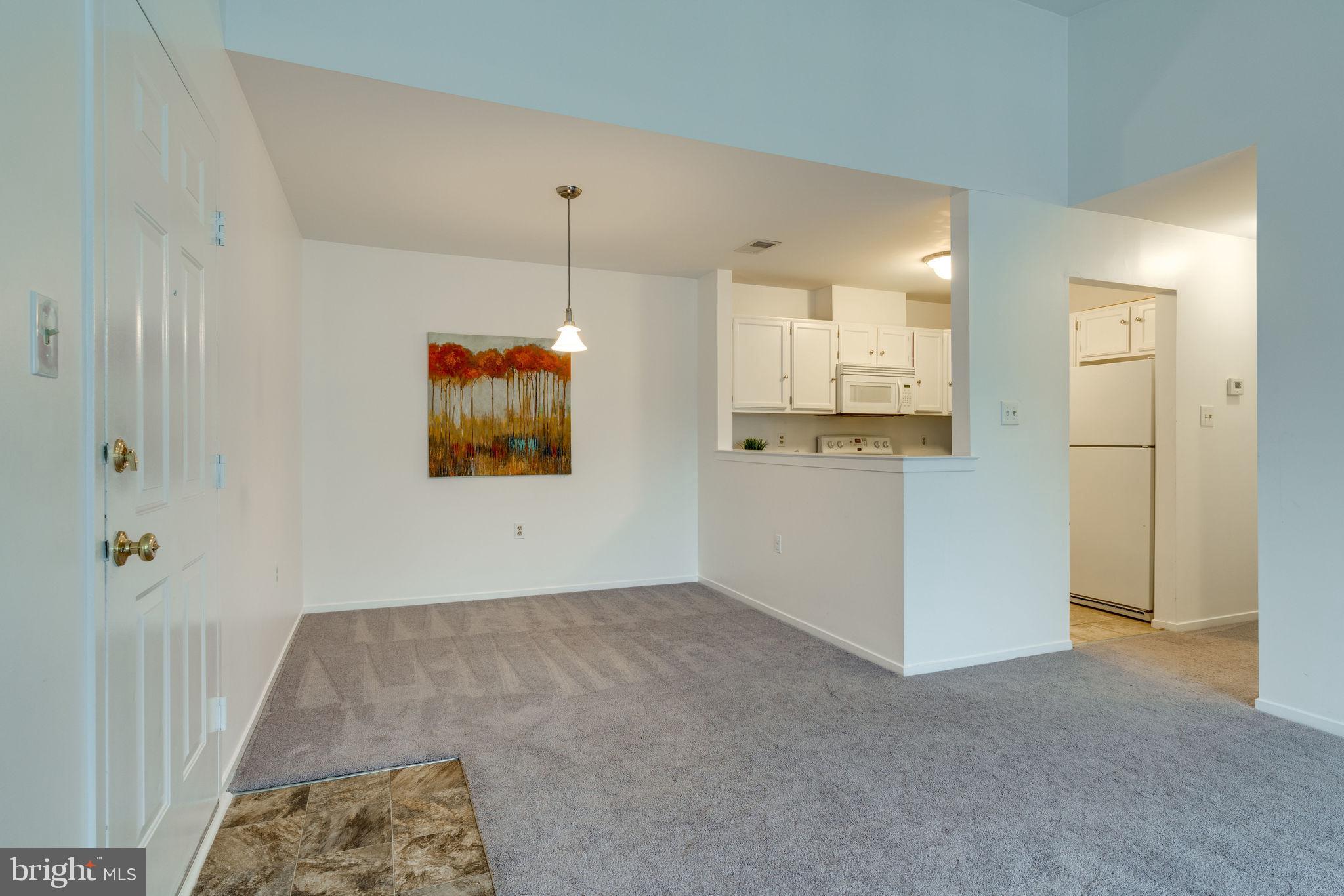 7800 D Harrowgate Circle, Unit 130 Springfield, VA 22152 - Photo 5 of 48 Open concept kitchen-dining-living