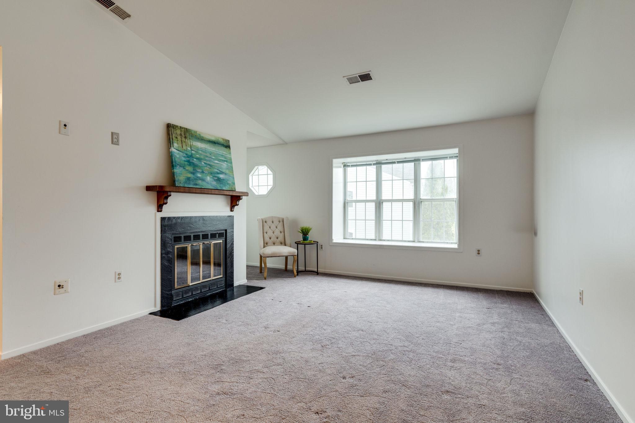 7800 D Harrowgate Circle, Unit 130 Springfield, VA 22152 - Photo 9 of 48 Lots of natural light and cozy fireplace in the LR
