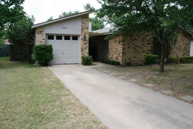a front view of a house with a garage