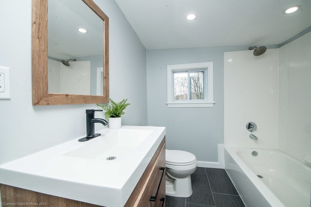 452 Tecumseh Street Fall River, MA 02721 - Photo 16 of 26 a bathroom with a sink toilet and shower