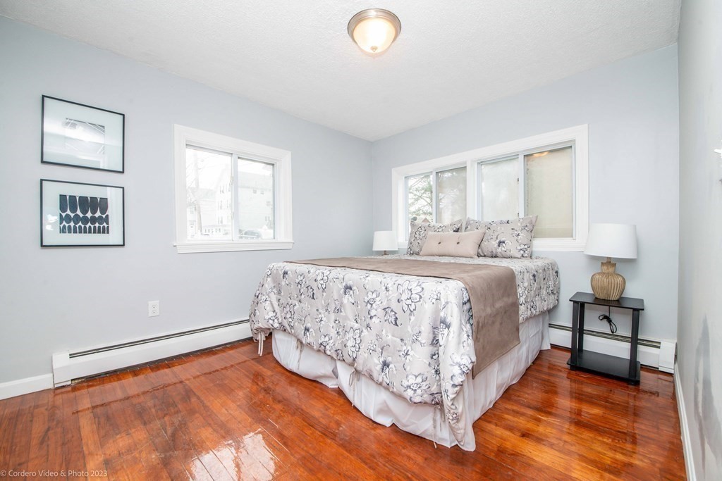 452 Tecumseh Street Fall River, MA 02721 - Photo 18 of 26 a bed room with a bed and a couch