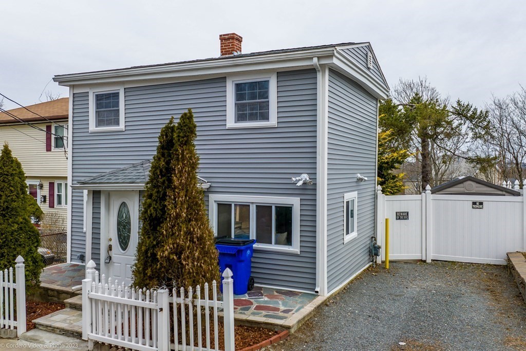 452 Tecumseh Street Fall River, MA 02721 - Photo 2 of 26 a front view of a house with a yard