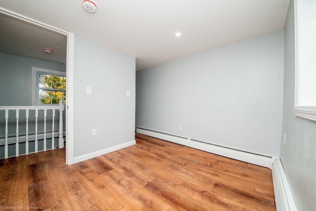452 Tecumseh Street Fall River, MA 02721 - Photo 21 of 26 wooden floor in an empty room