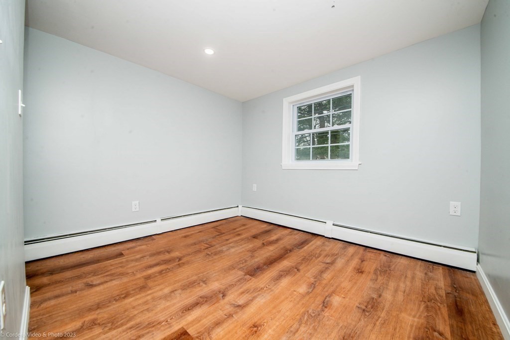 452 Tecumseh Street Fall River, MA 02721 - Photo 22 of 26 an empty room with a window