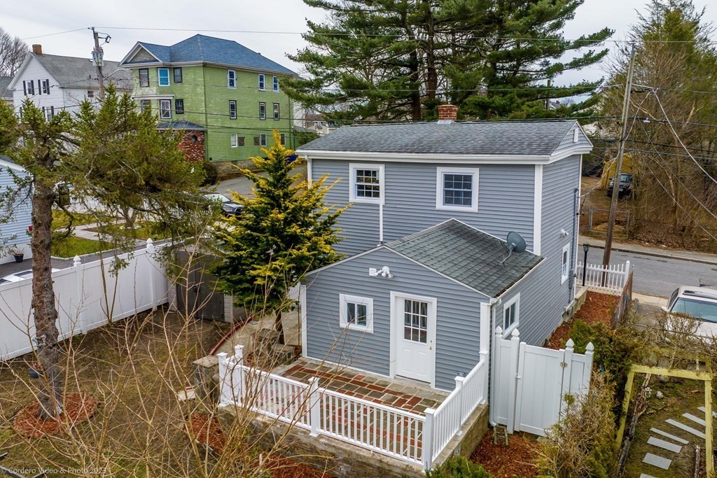 452 Tecumseh Street Fall River, MA 02721 - Photo 5 of 26 a view of a house with a yard and plants