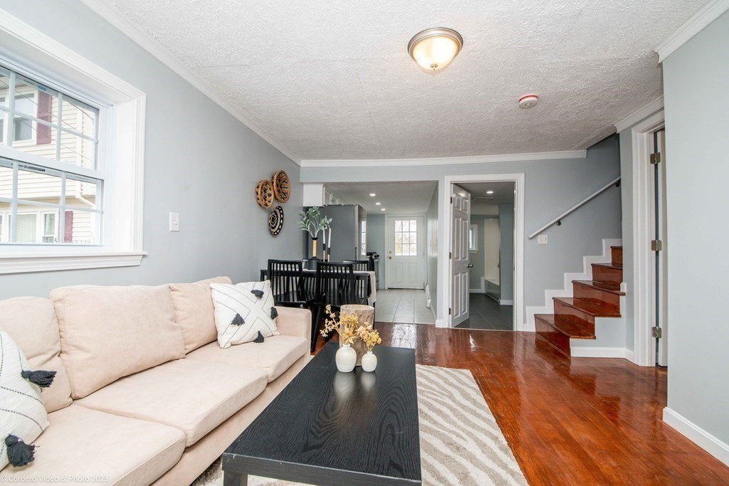 452 Tecumseh Street Fall River, MA 02721 - Photo 7 of 26 a living room with furniture and a table