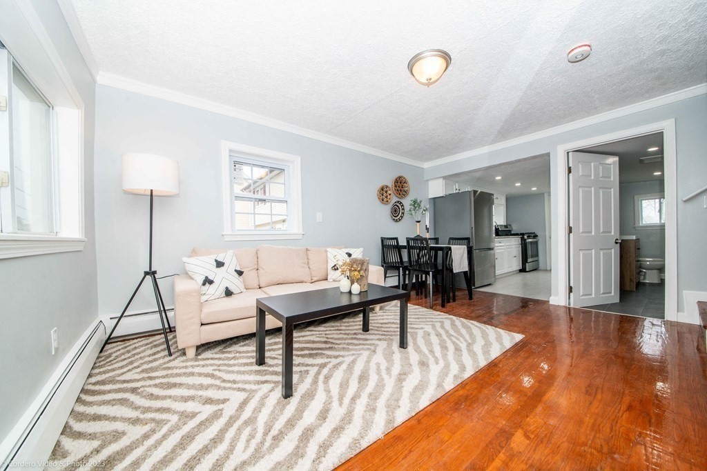 452 Tecumseh Street Fall River, MA 02721 - Photo 9 of 26 a living room with furniture and a table