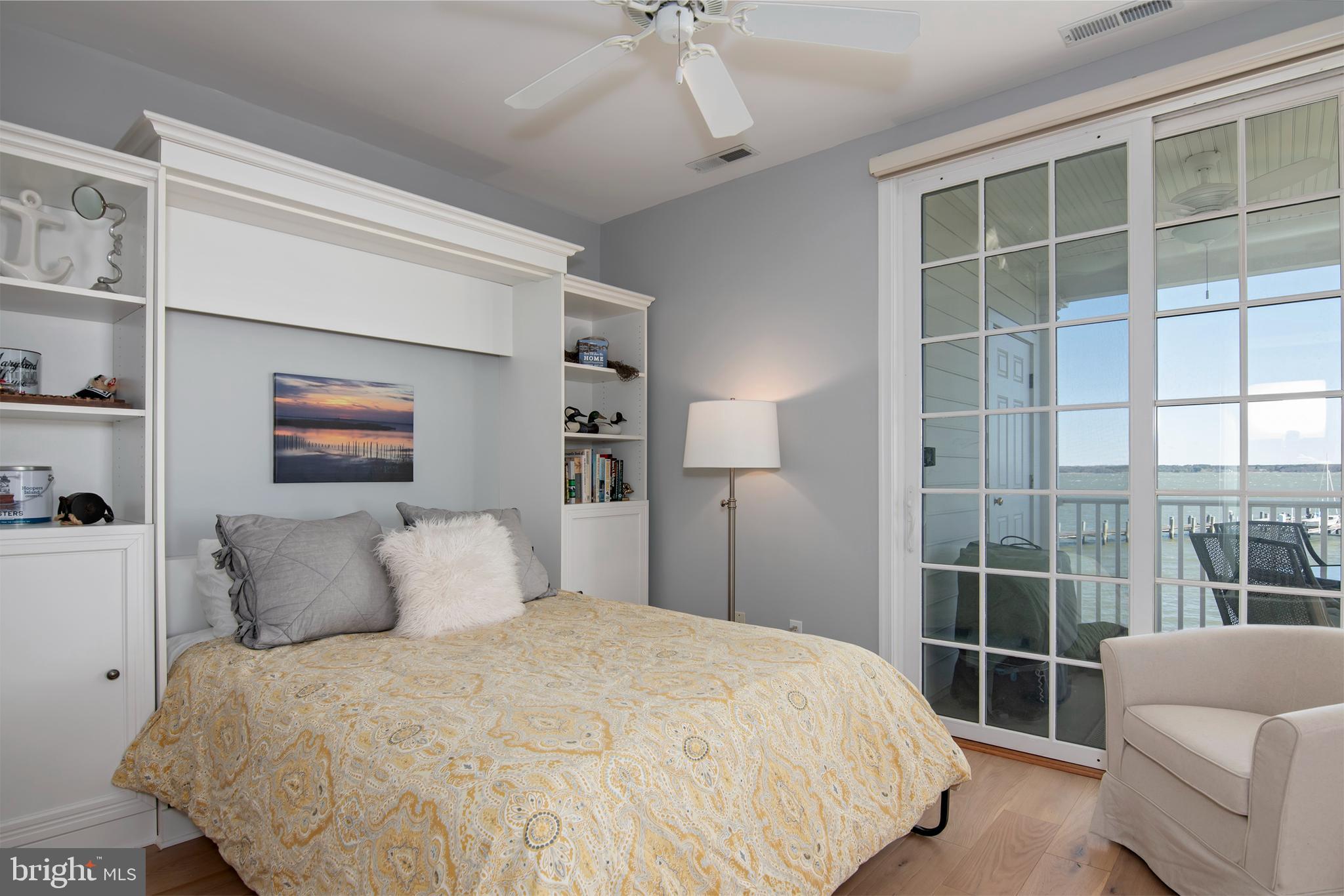 3 Oakley Street, Unit 201 Cambridge, MD 21613 - Photo 25 of 41 a bedroom with a large bed and a window