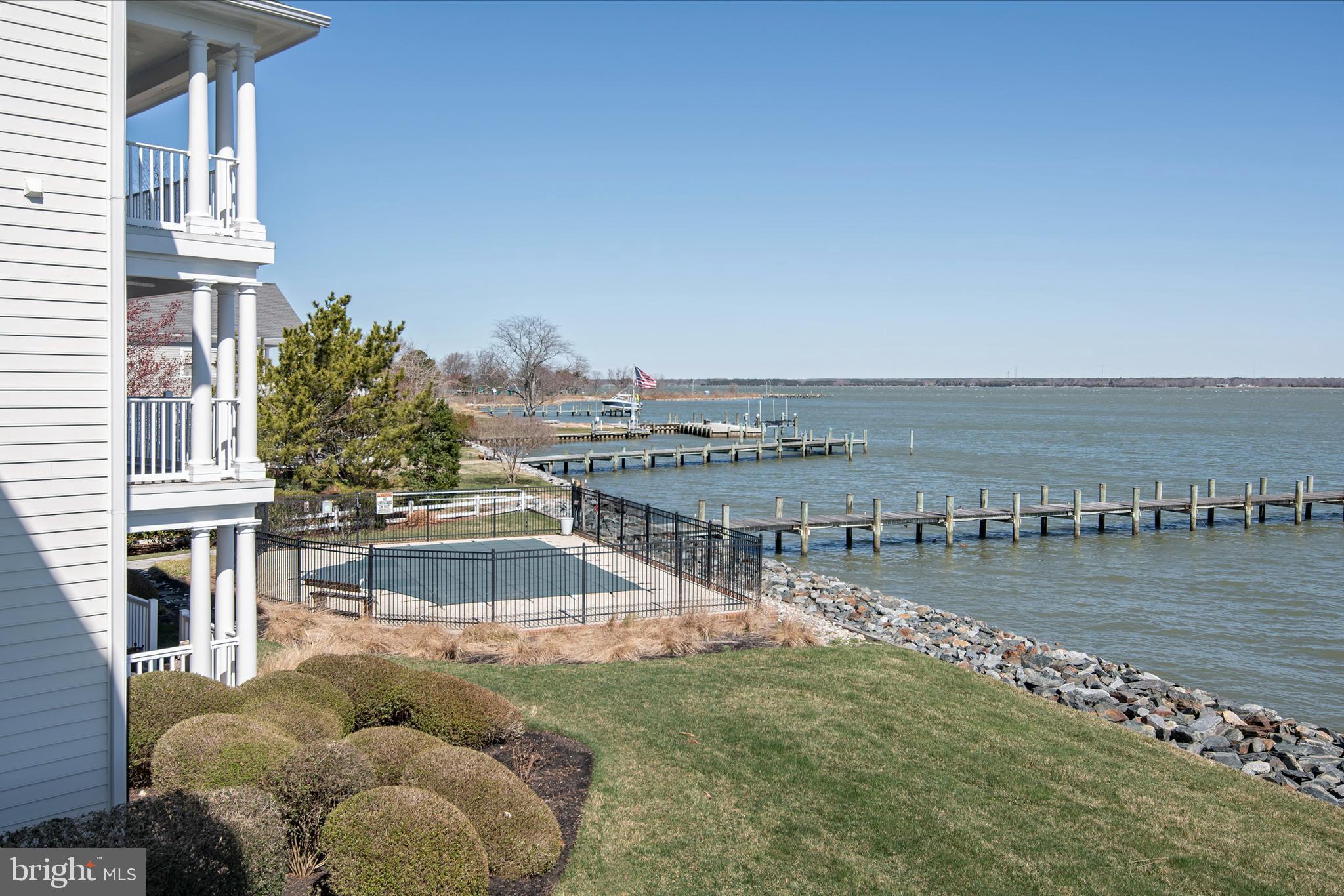 3 Oakley Street, Unit 201 Cambridge, MD 21613 - Photo 30 of 41 a view of a lake with couches in front of house
