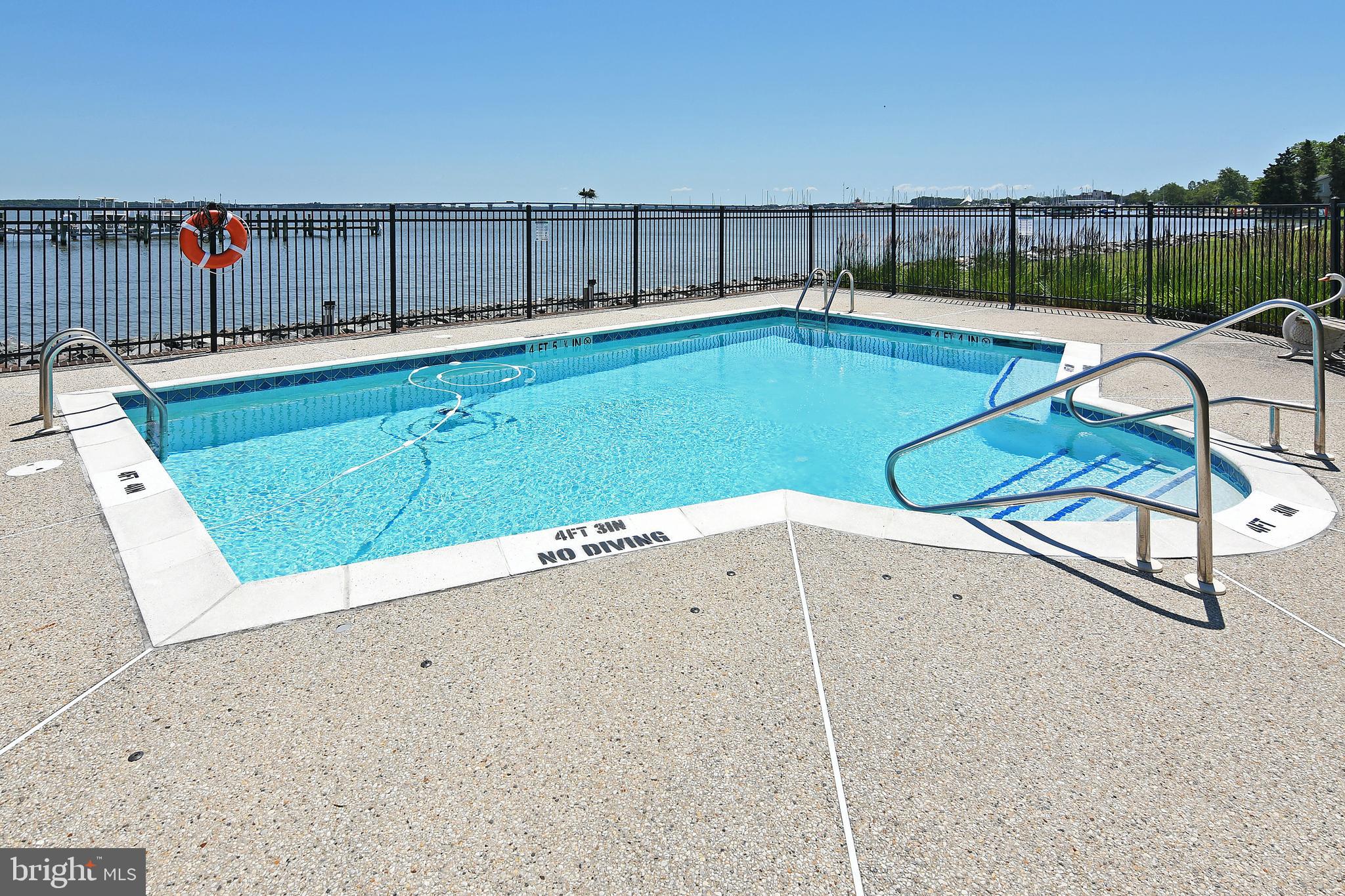 3 Oakley Street, Unit 201 Cambridge, MD 21613 - Photo 31 of 41 swimming pool view with a outdoor seating