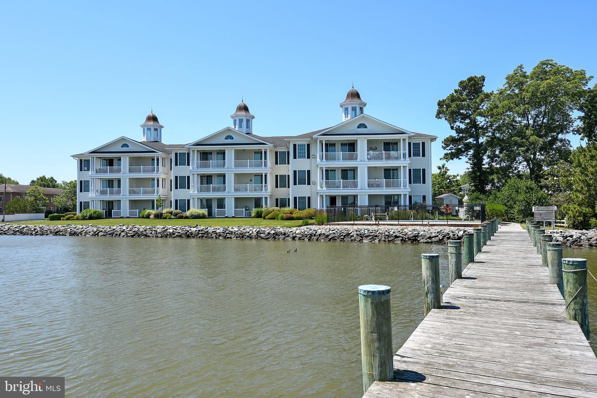 3 Oakley Street, Unit 201 Cambridge, MD 21613 - Photo 32 of 41 a view of a lake with a city skyline