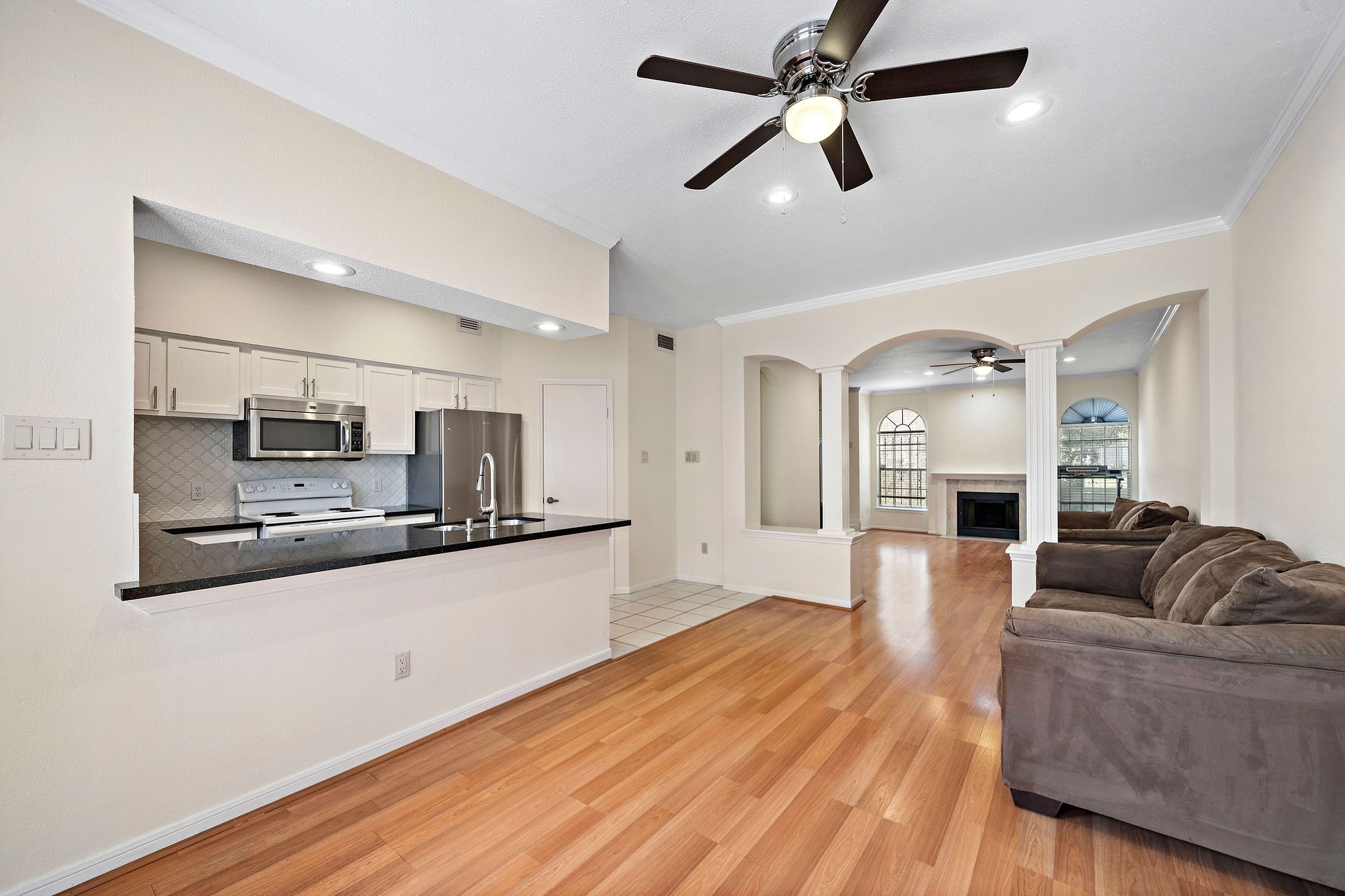 7941 Knight Road, Unit 20 Houston, TX 77054 - Photo 4 of 11 Kitchen opens to the dining room and spacious living area, offering seamless flow for entertaining.