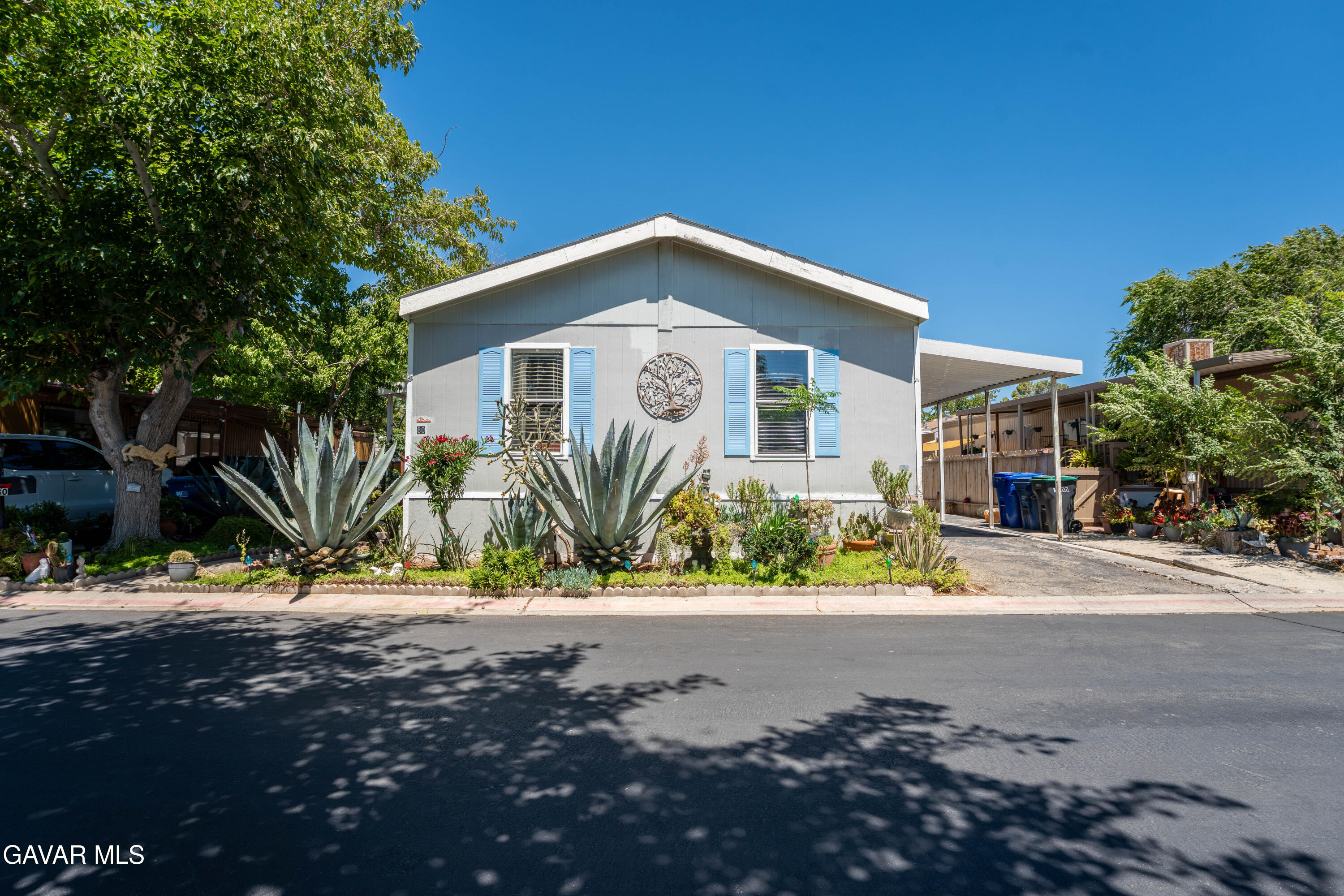 3524 Avenue R Palmdale, CA 93550 - Photo 2 of 3 a front view of a house with a yard and a garage