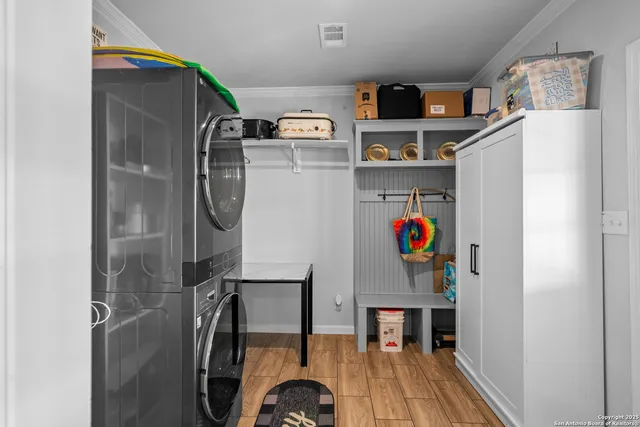 a view of storage and utility room with washer and dryer