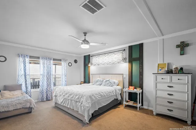 a bedroom with a bed and a dresser