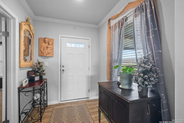 a view of an entryway with wooden floor