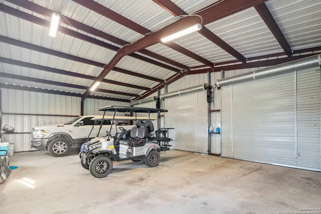 a view of a garage with parked cars