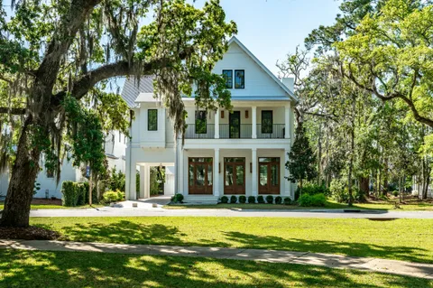 a front view of house with yard and green space