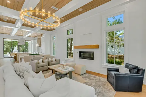 a view of work space with furniture and windows