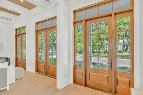 a living room filled with furniture and a large window