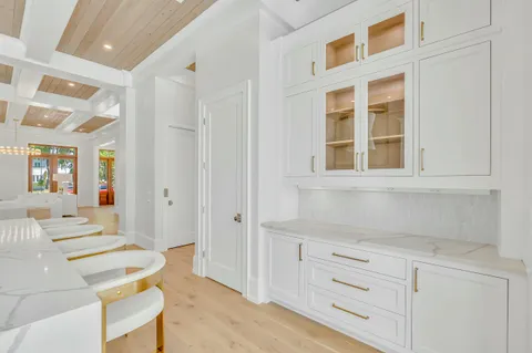 a white bath tub sitting in a bathroom next to a window