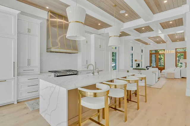 a bathroom with a granite countertop sink a toilet and shower