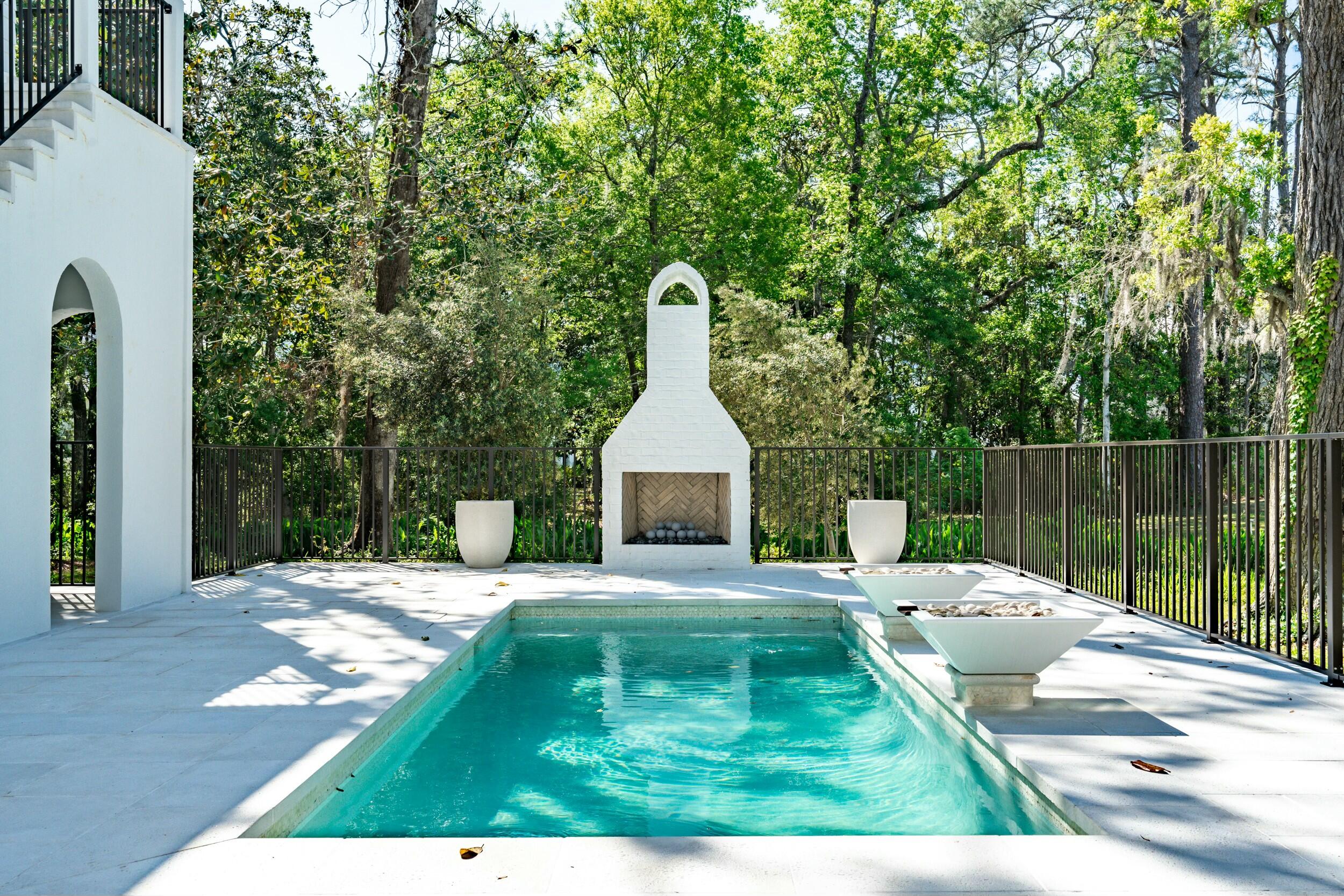 13 Tyler Drive Santa Rosa Beach, FL 32459 - Photo 3 of 78 a view of a patio with a dining table and chairs with wooden fence