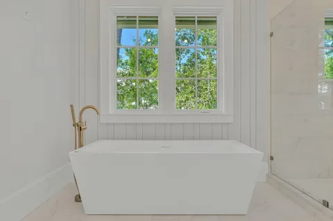 a view of a kitchen with a sink and a window