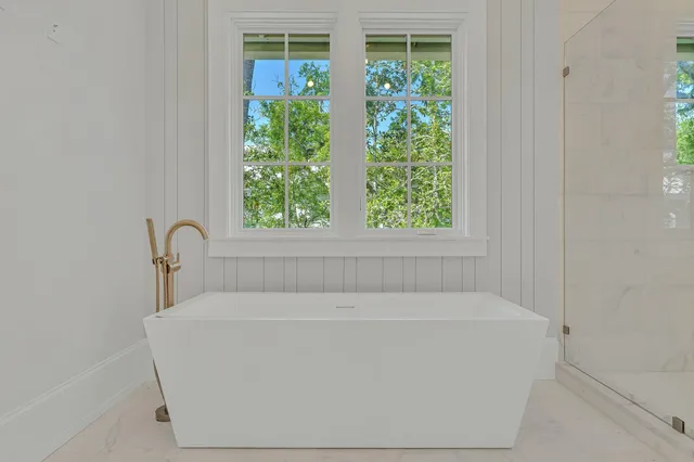 a view of a kitchen with a sink and a window
