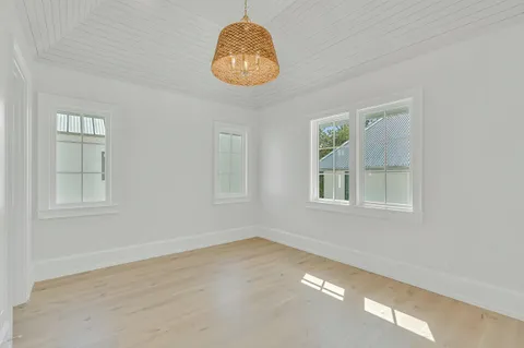 a view of a lake with a house swimming pool and sitting area