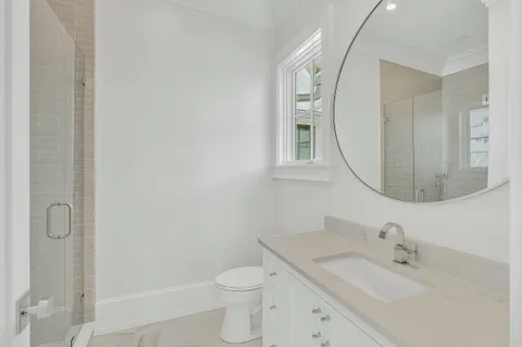 an aerial view of a house with a yard basket ball court and outdoor seating