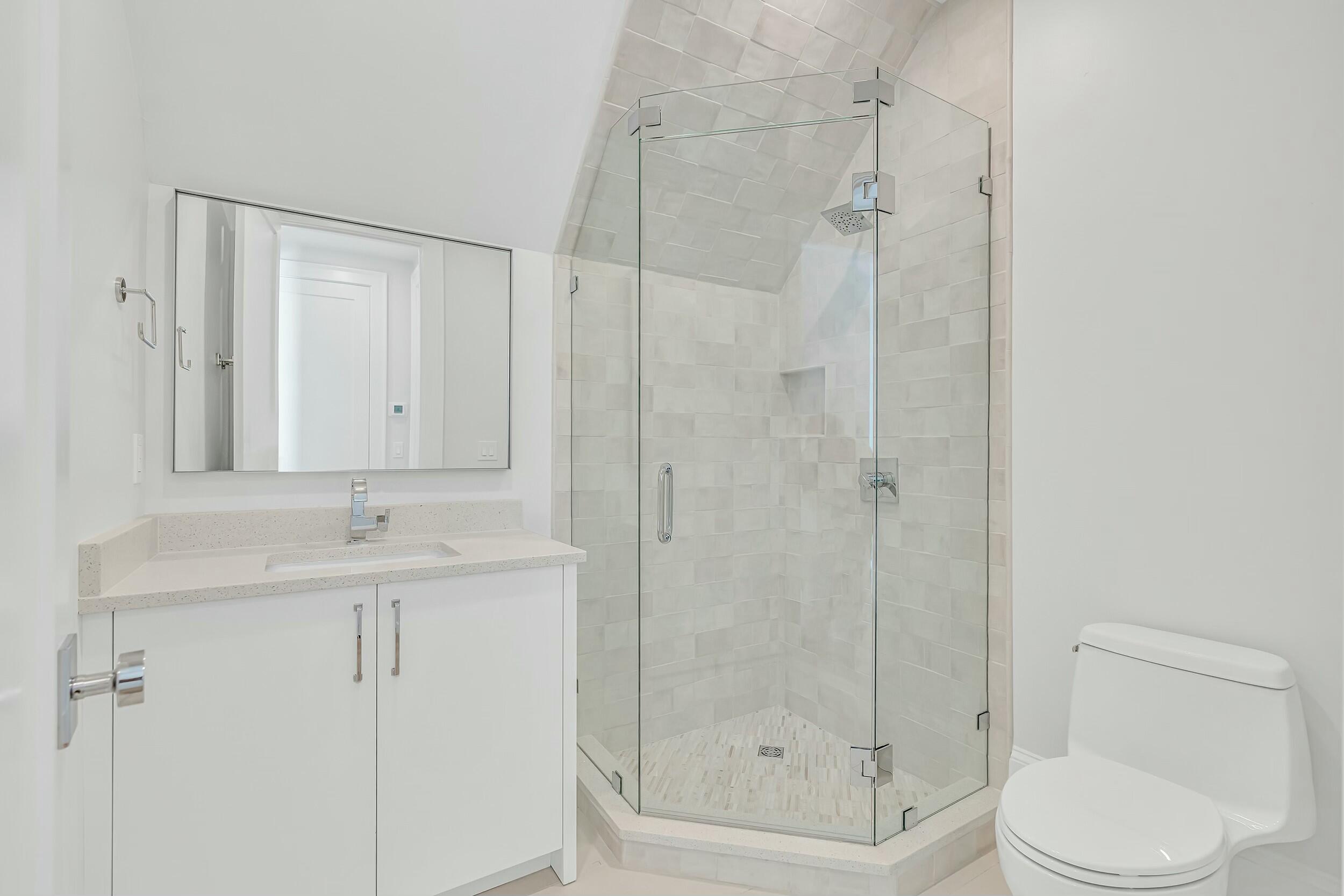 13 Tyler Drive Santa Rosa Beach, FL 32459 - Photo 52 of 78 a bathroom with a granite countertop sink a toilet and shower