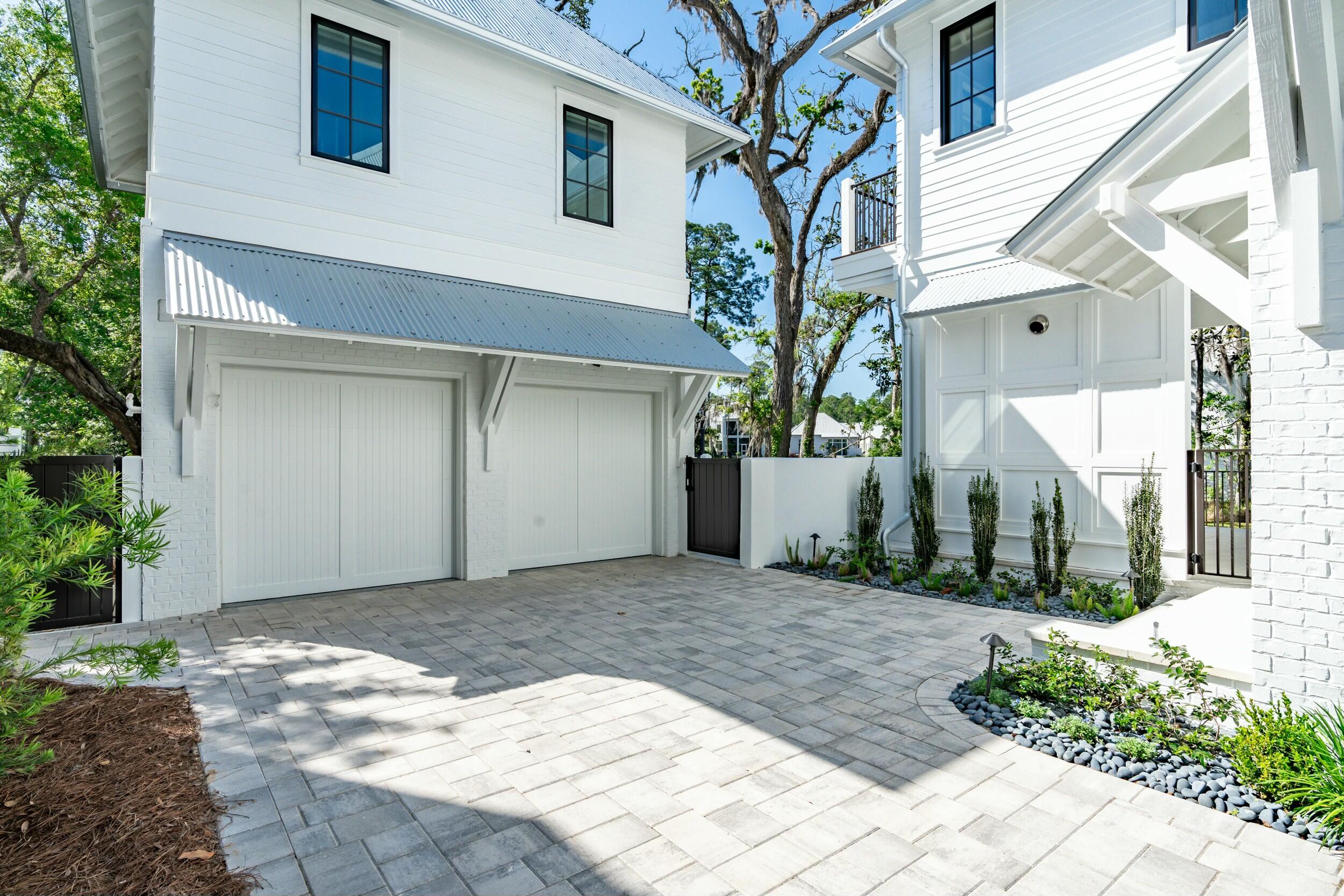 13 Tyler Drive Santa Rosa Beach, FL 32459 - Photo 57 of 78 a view of a white house with a small yard and plants