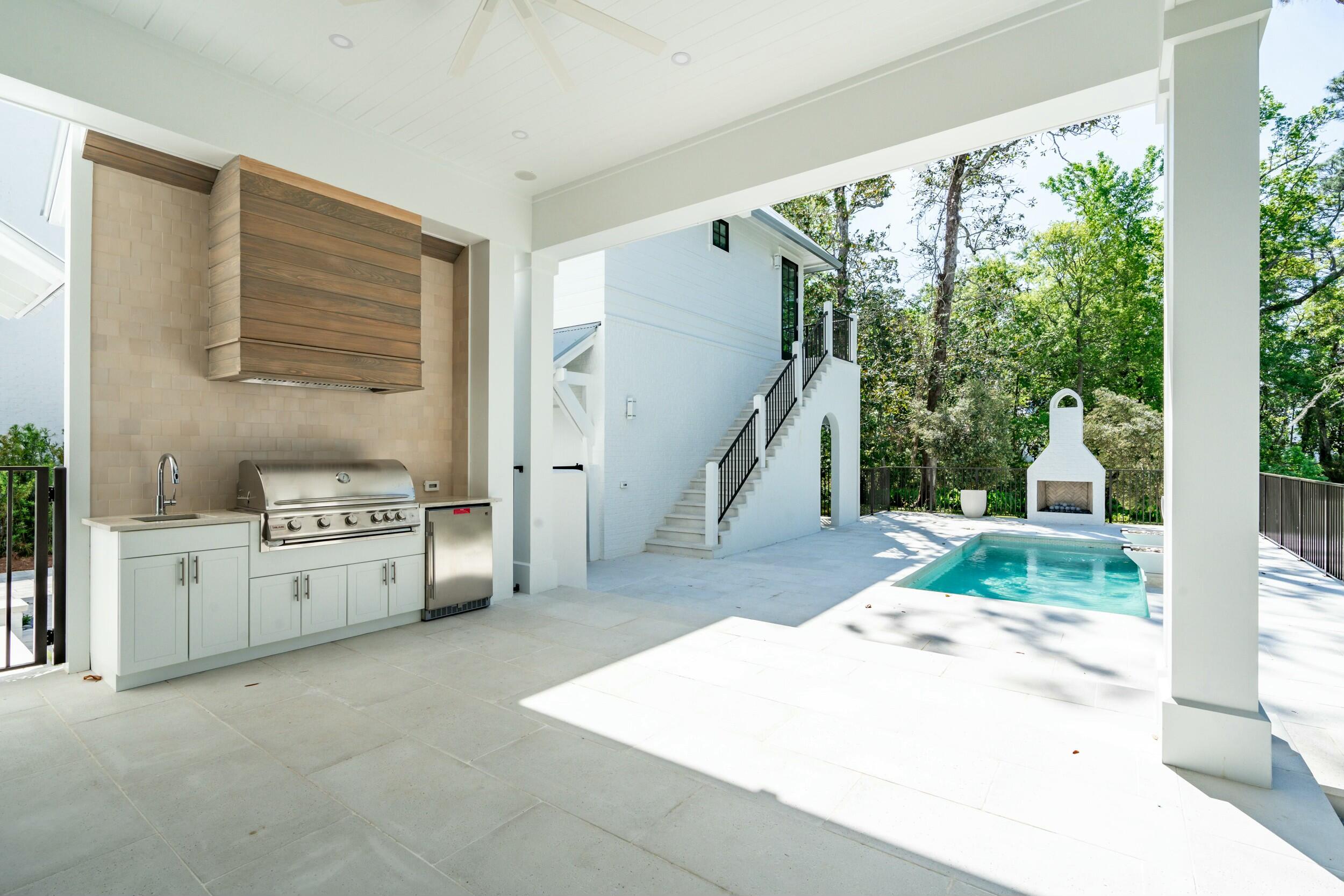 13 Tyler Drive Santa Rosa Beach, FL 32459 - Photo 70 of 78 a kitchen with a stove a sink and a refrigerator