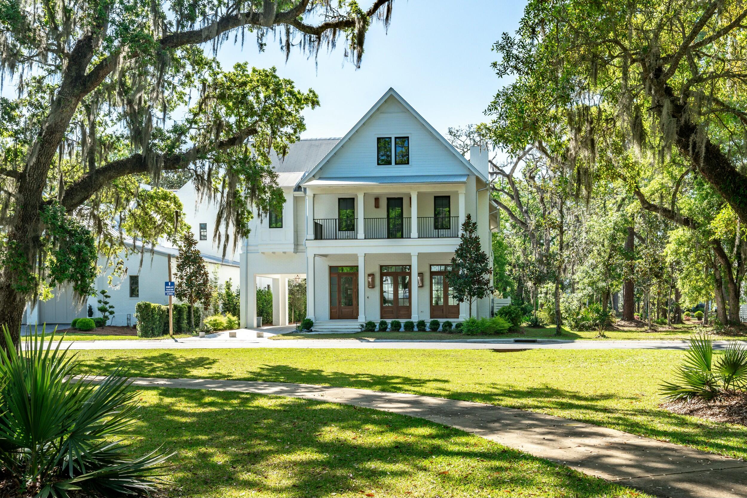 13 Tyler Drive Santa Rosa Beach, FL 32459 - Photo 7 of 78 a front view of a house with a swimming pool