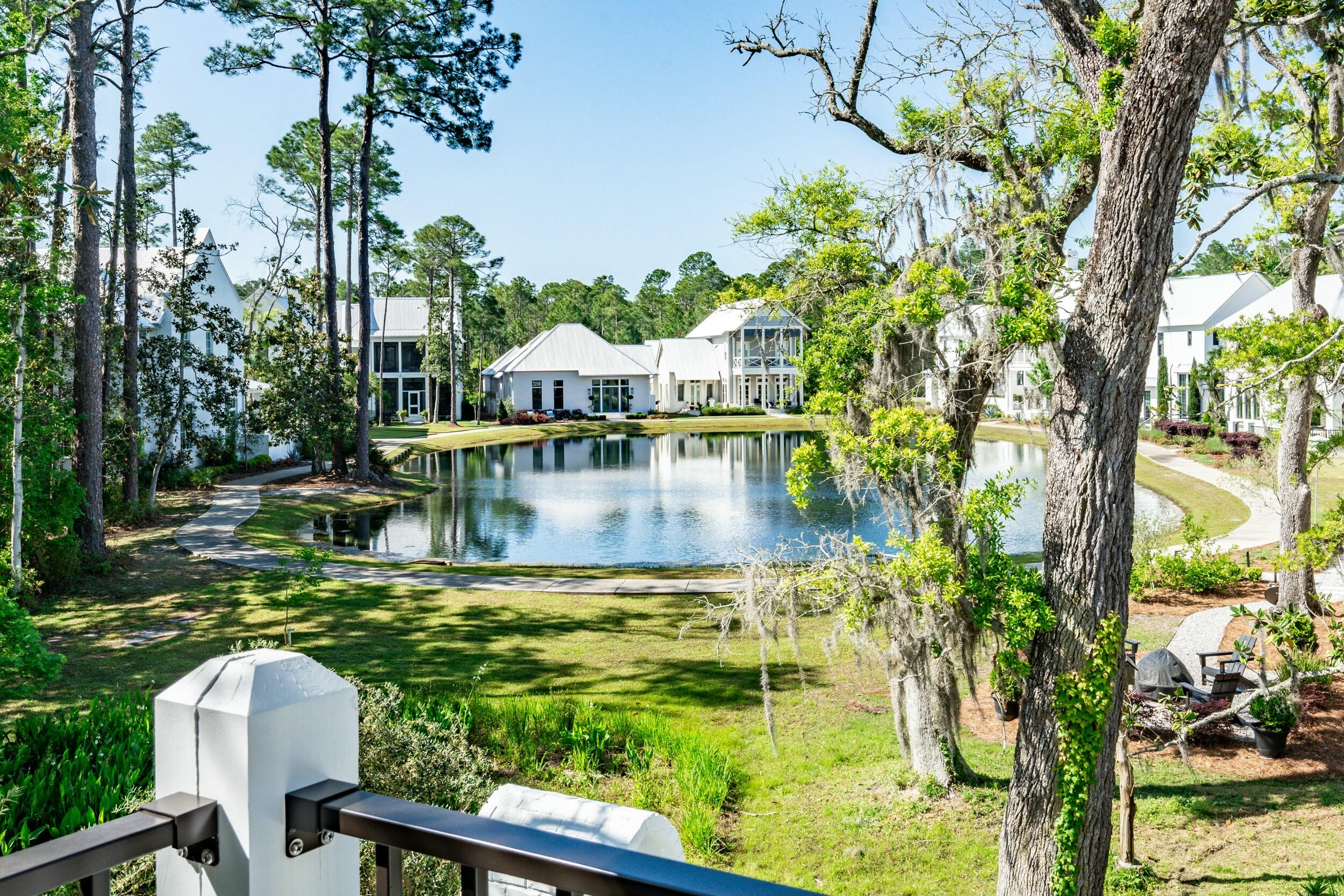 13 Tyler Drive Santa Rosa Beach, FL 32459 - Photo 73 of 78 a view of a lake with a house swimming pool and sitting area