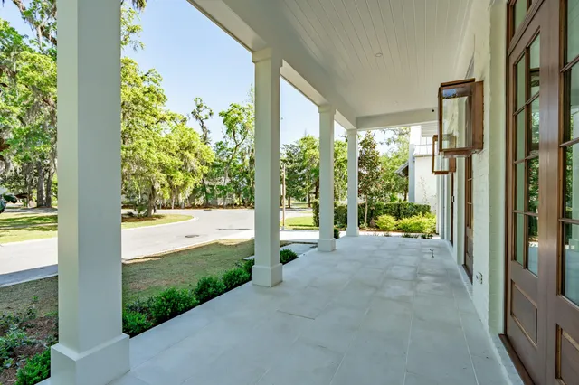 a bathroom with a granite countertop sink mirror and bathtub