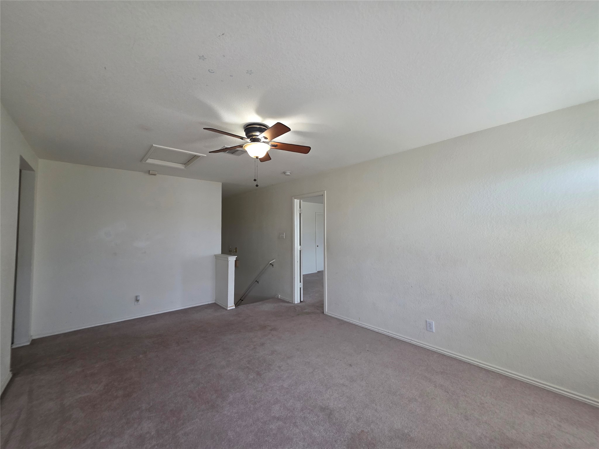 189 Ruidoso Road Kyle, TX 78640 - Photo 15 of 31 A comfortable upstairs living area offers an inviting atmosphere and convenient access to adjacent rooms.