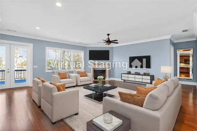 a view of a house with a small yard plants and large tree