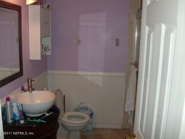 7344 Melvin Road Jacksonville, FL 32210 - Photo 5 of 11 a bathroom with a toilet and a sink