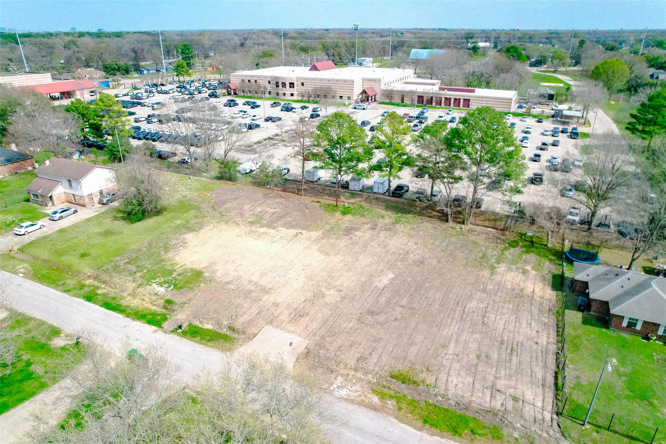 8524 Observatory Street Houston, TX 77088 - Photo 15 of 17 an aerial view of a house with a yard and lake view
