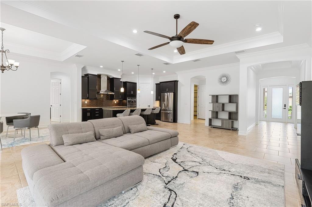 1584 Mockingbird Drive Naples, FL 34120 - Photo 15 of 40 a living room with furniture and a view of kitchen